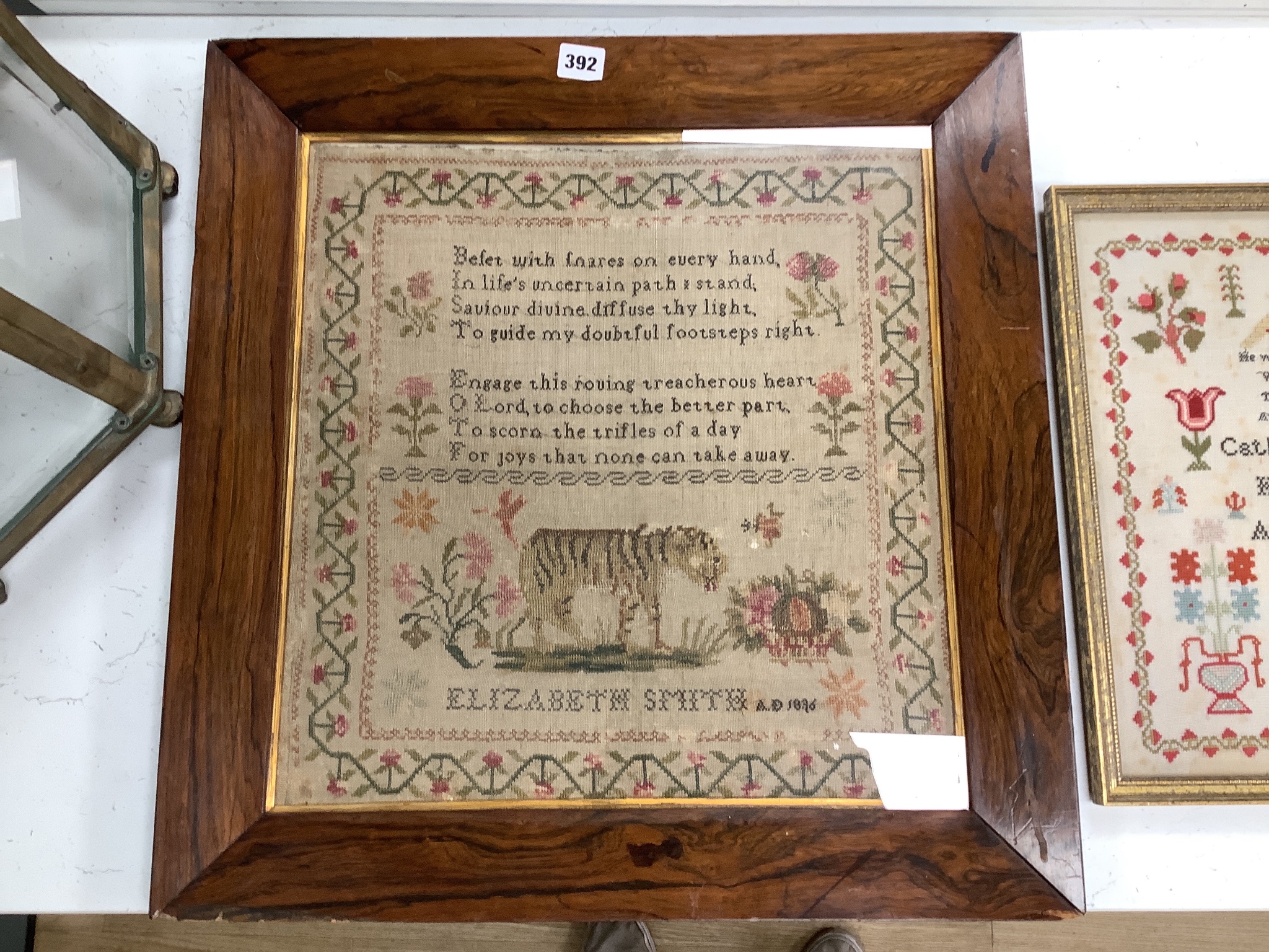 A William IV needlework sampler, worked with text and a lion, by Elizabeth Smith, dated 1836 and a Victorian needlework sampler, by Catherine Summer, dated 1849